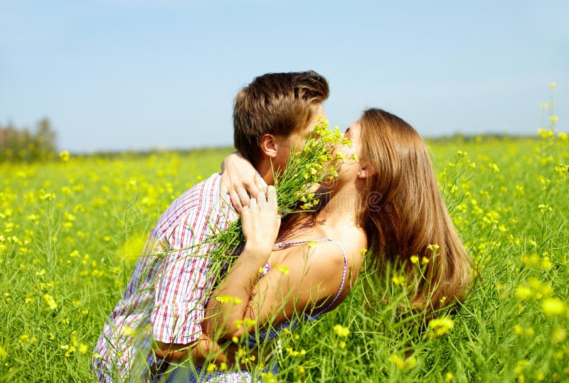 Kiss in the field stock photo. Image of environment, flower - 23566166