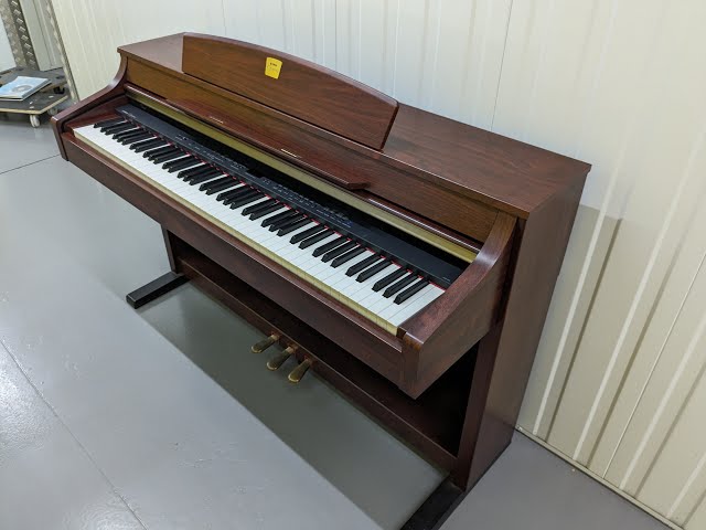 Yamaha Clavinova CLP-340 digital piano in mahogany finish stock