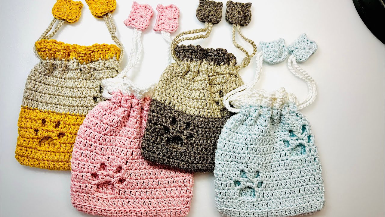 Crochet: A cute cat motif and paw print drawstring bag that even