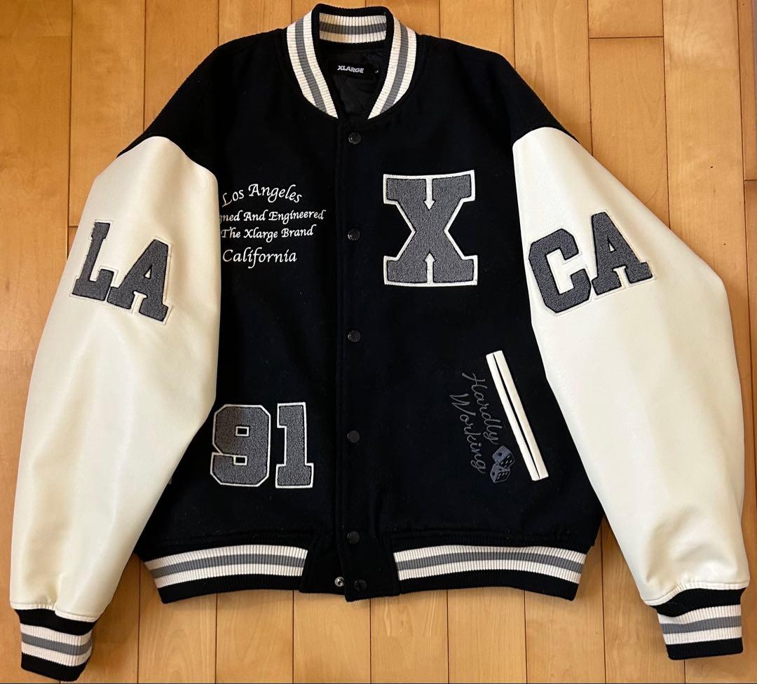 XLARGE スタジャン 黒/白ロゴ刺繍 - メルカリ