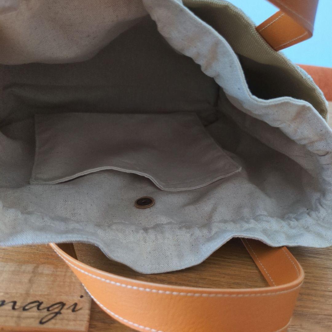 【1560】あおりポケットの巾着バッグ＊ミナペルホネン