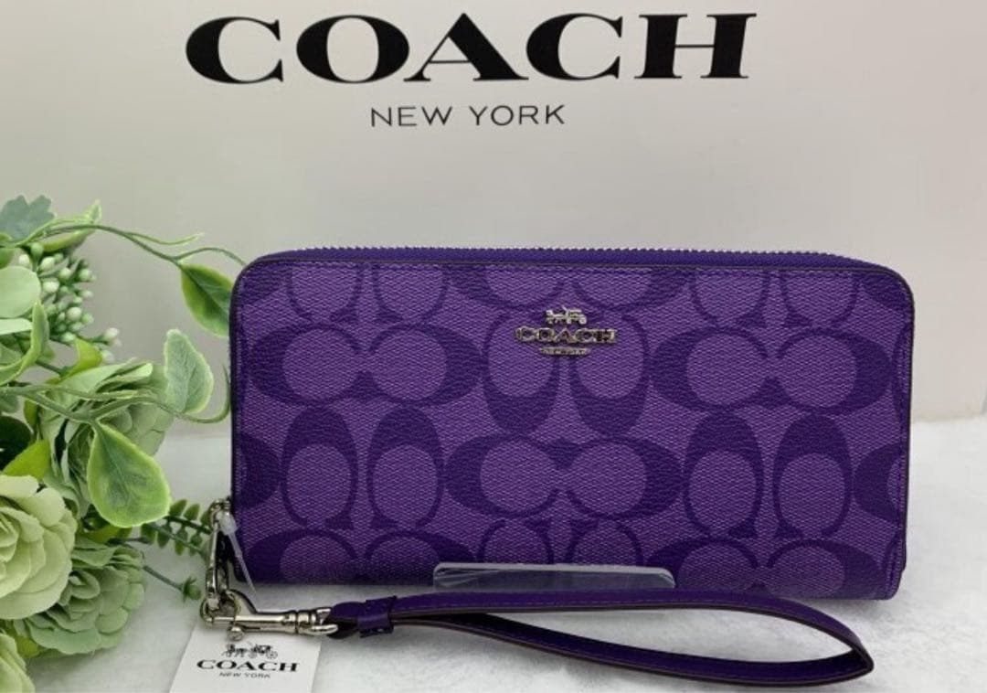 新品未使用コーチ長財布パープルシグネチャーレディースメンズ送料無料