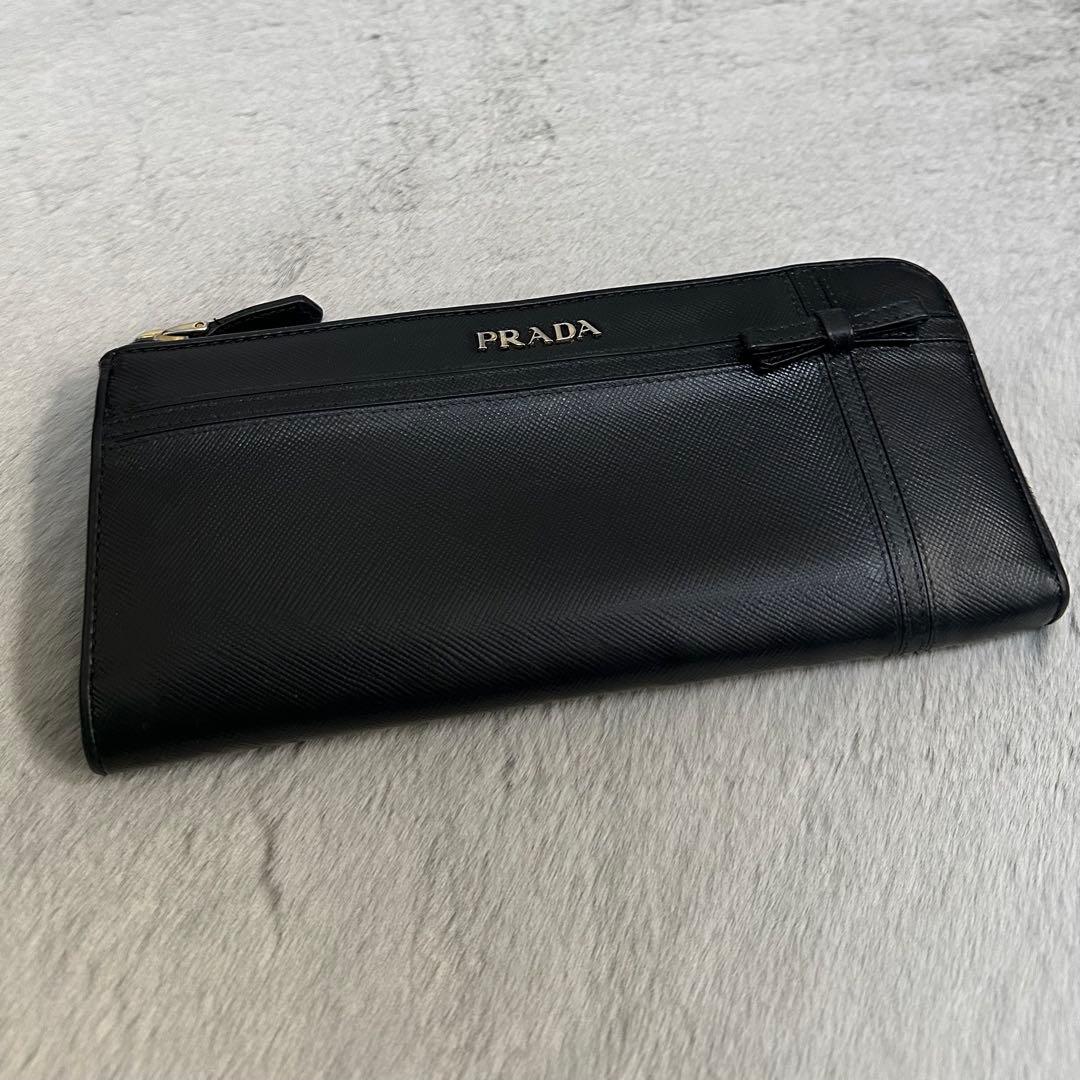 PRADA プラダ 長財布 リボン ゴールドロゴ ラウンドファスナー - メルカリ